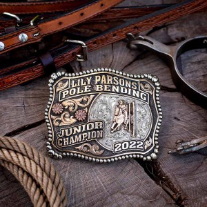 A custom rodeo belt buckle trophy for SWD 4H Rodeo Tie Down Grand Champion featuring a calf roping cowboy figure 